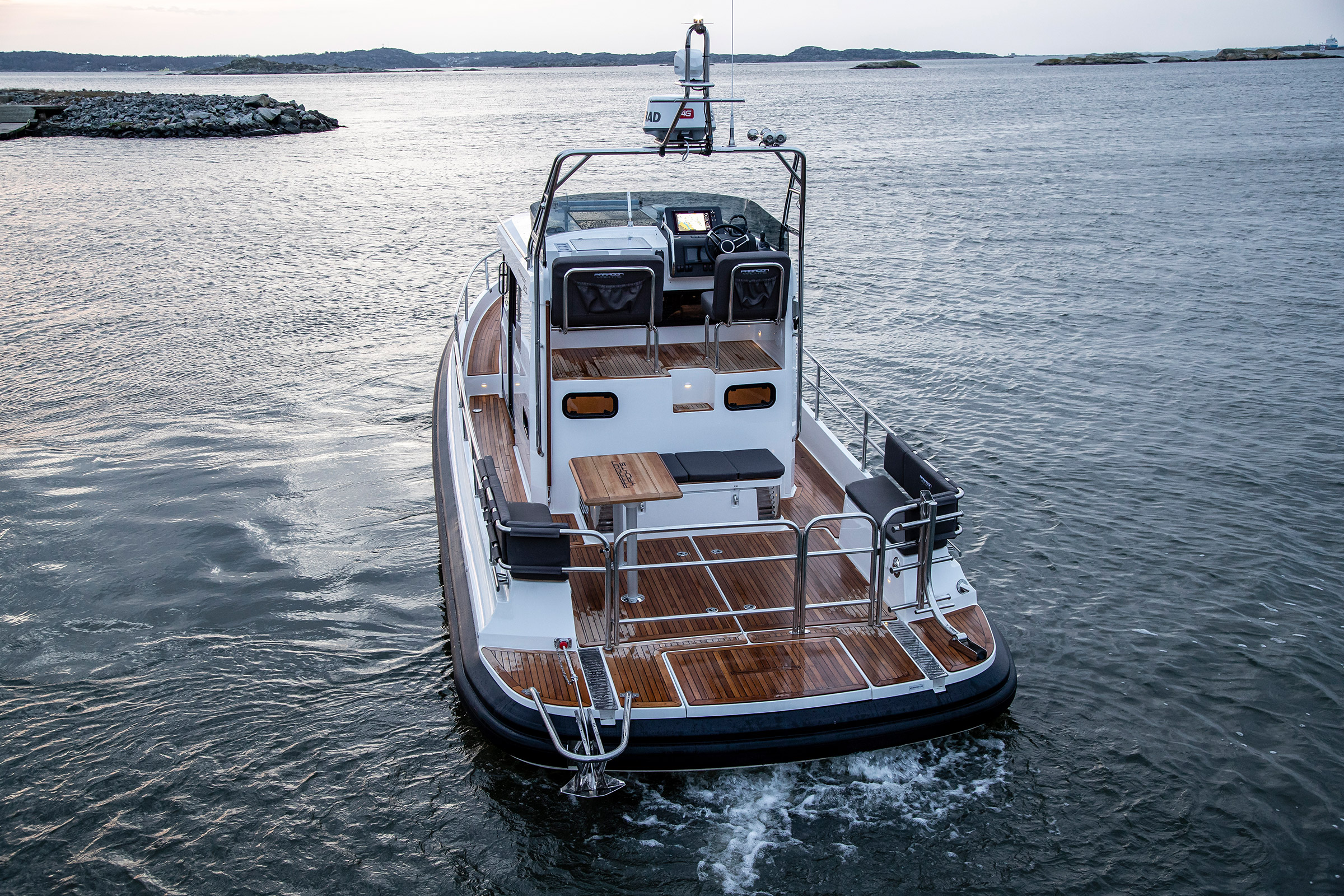 Paragon 31 flybridge, picture taken from the back. On the sea with some small islands around.